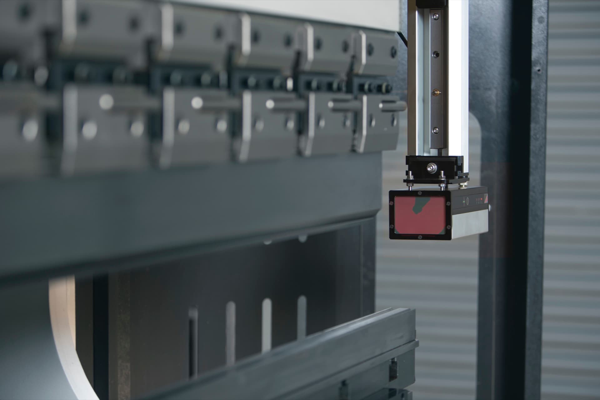 Lazer Safe Sentinel sensor module installed beneath the punch on a press brake