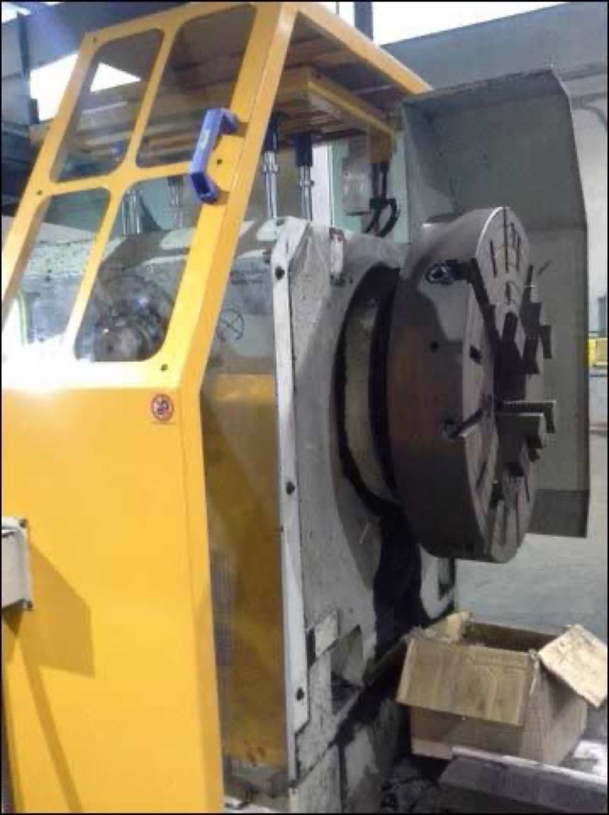 Yellow safety enclosure around a CNC turret